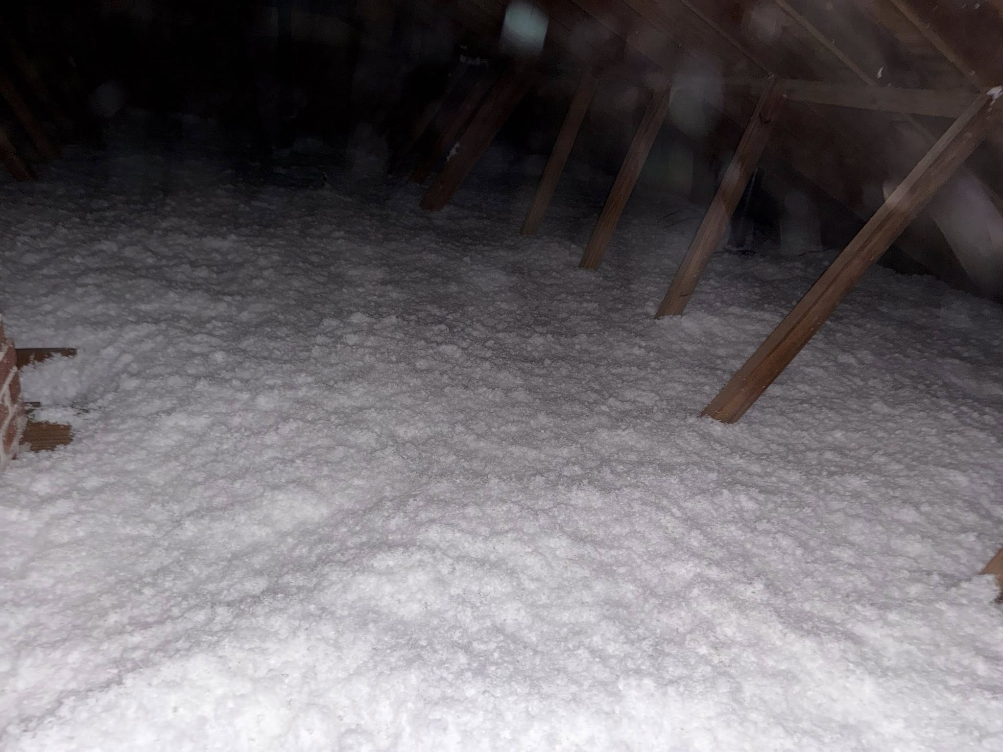 Blown-in insulation in attic area