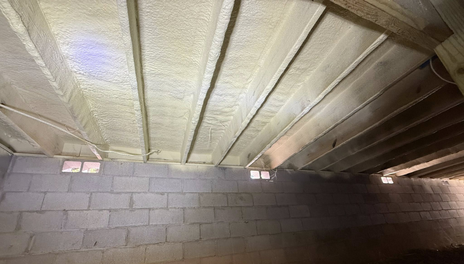 Crawlspace with new spray insulation
