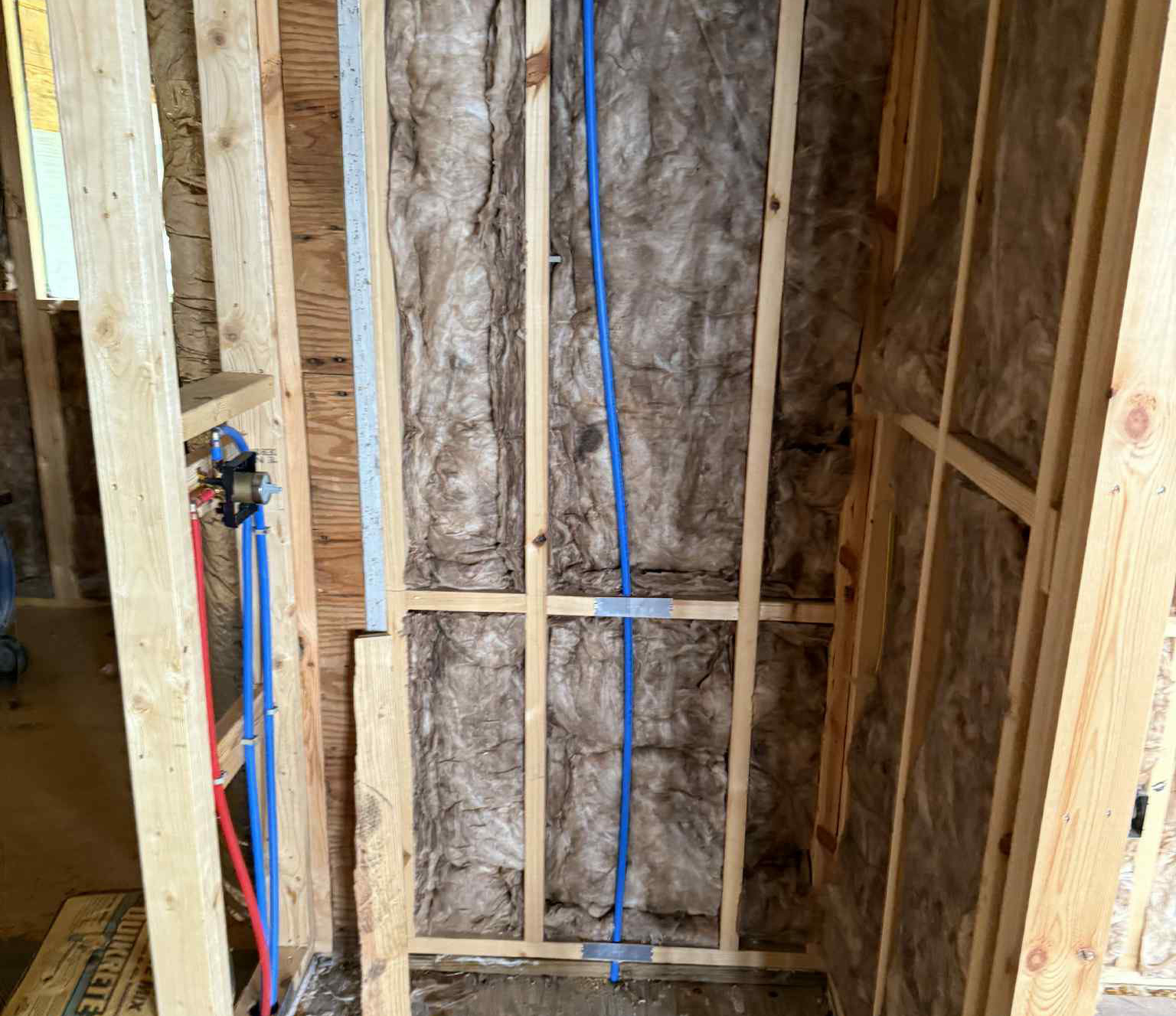 Fiberglass bat insulation in walls