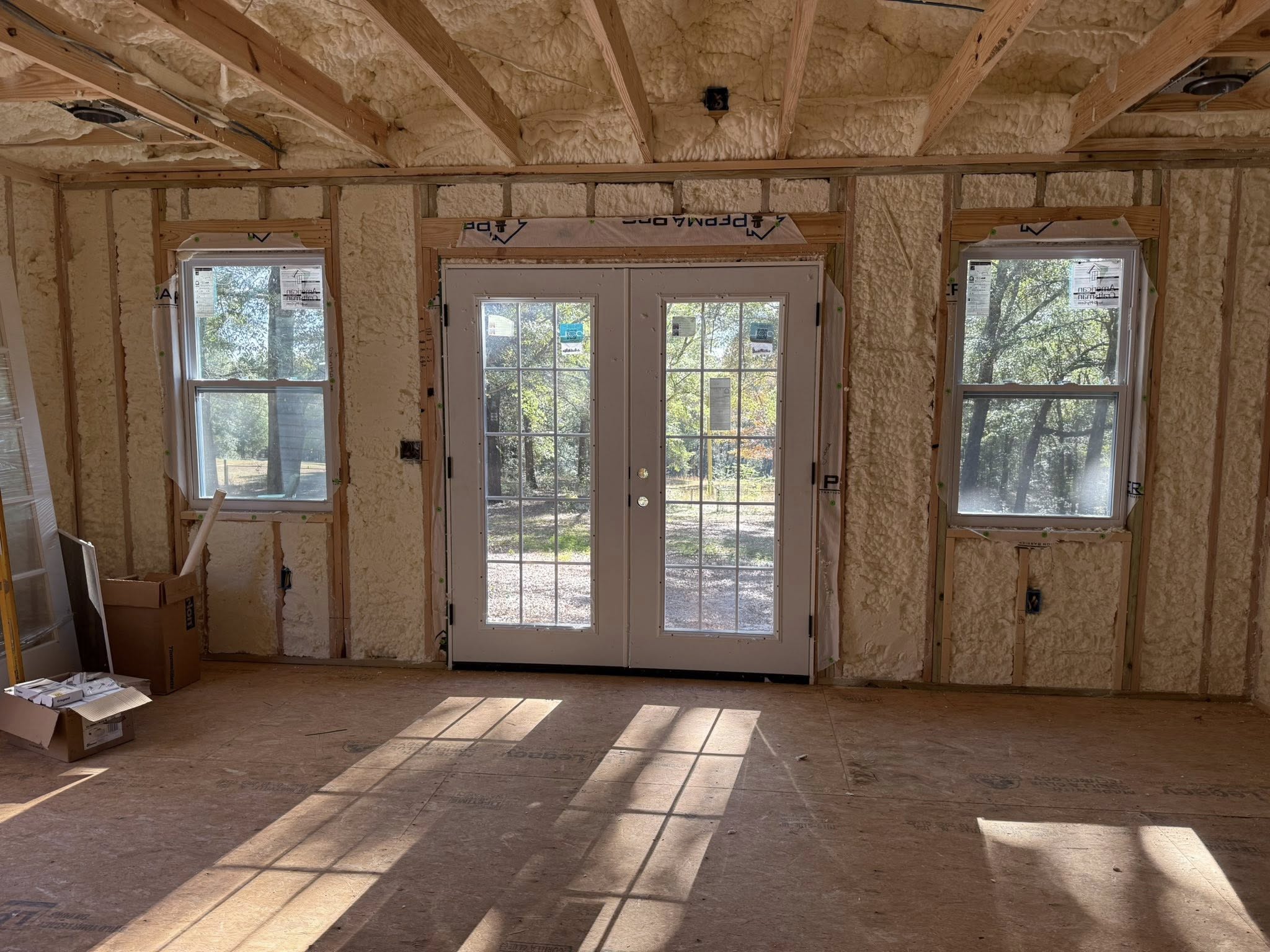 Spray foam insulation around doorways