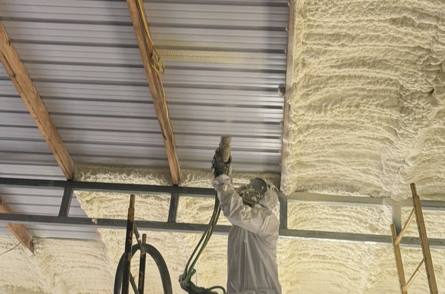 Spray foam insulation sealing gaps and cavities